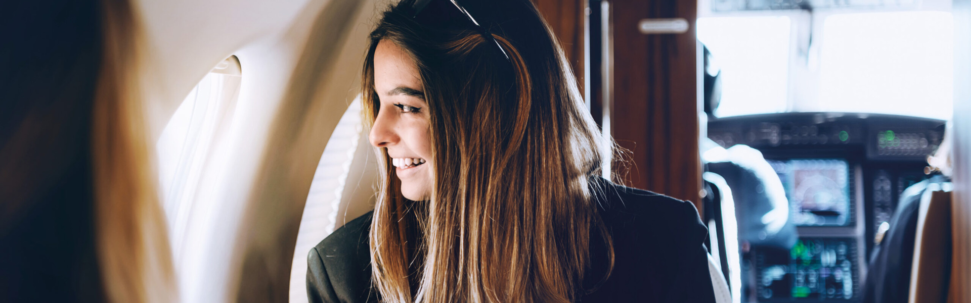 Woman looking out of the window of an aeroplane
